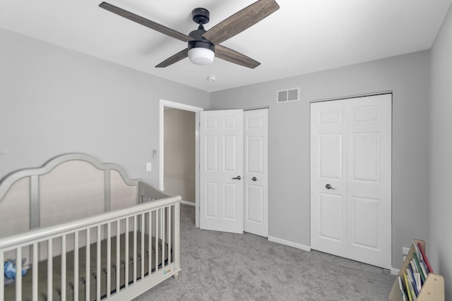 3174 Larrabee Dr, Geneva, IL 60134 - bedroom with carpet floors, two closets, a ceiling fan, and baseboards