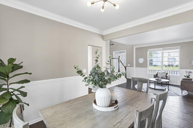 3174 Larrabee Dr, Geneva, IL 60134 - dining area with ornamental molding, wood finished floors, stairs, a wainscoted wall, and a chandelier