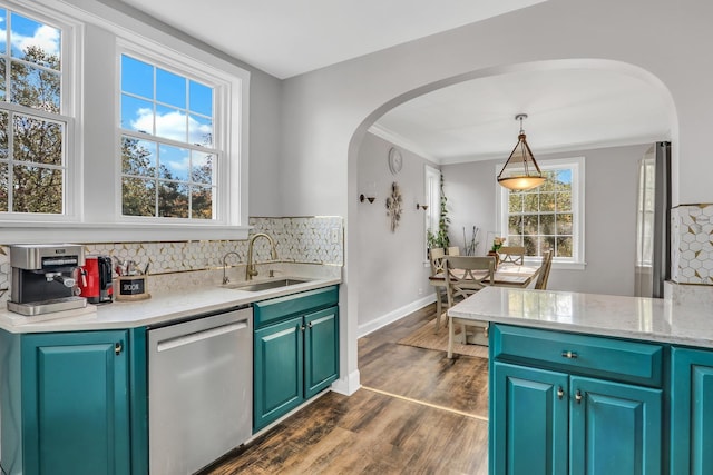 1217 Hull Ter Unit 2A, Evanston, IL 60202 - kitchen with stainless steel dishwasher, a sink, arched walkways, backsplash, and light countertops
