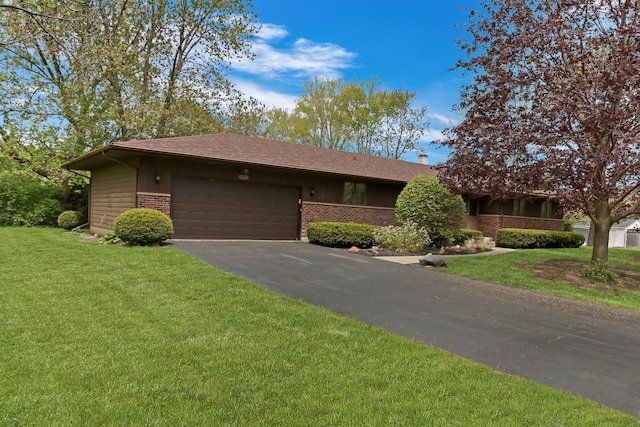 10762 W Talmadge Ave, Beach Park, IL 60099 - single story home with brick siding, an attached garage, driveway, and a front yard