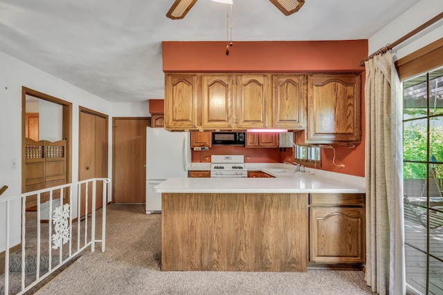 10762 W Talmadge Ave, Beach Park, IL 60099 - kitchen with white appliances, plenty of natural light, a sink, and a peninsula
