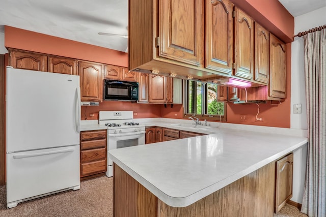 10762 W Talmadge Ave, Beach Park, IL 60099 - kitchen with white appliances, a sink, a peninsula, and light countertops