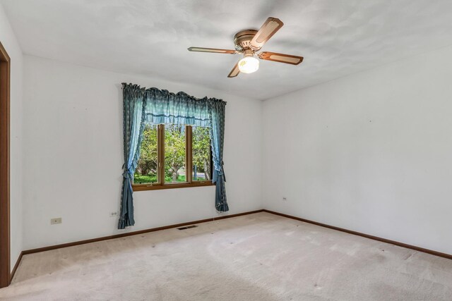10762 W Talmadge Ave, Beach Park, IL 60099 - unfurnished room featuring baseboards, carpet, and a ceiling fan