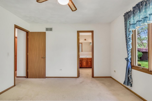 10762 W Talmadge Ave, Beach Park, IL 60099 - unfurnished bedroom featuring light carpet, baseboards, and ensuite bathroom