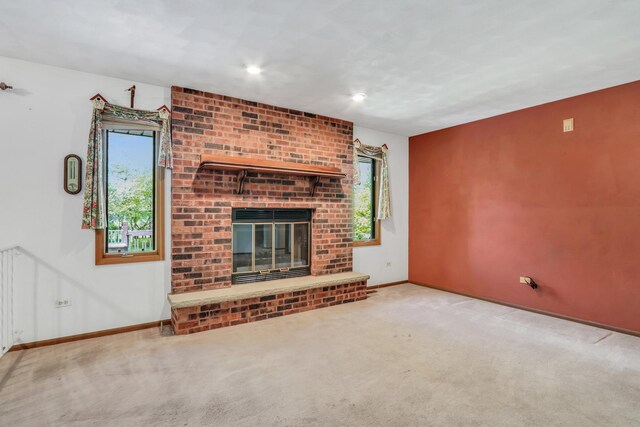 10762 W Talmadge Ave, Beach Park, IL 60099 - unfurnished living room with carpet floors, baseboards, and a fireplace