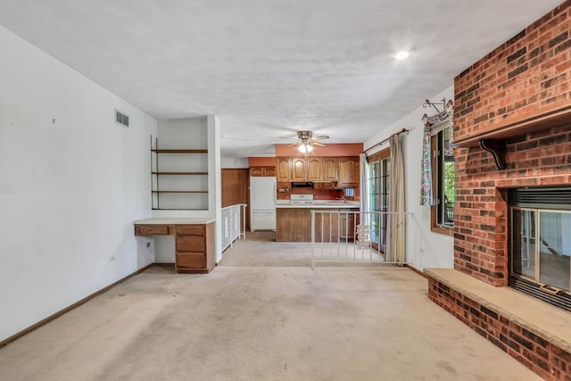 10762 W Talmadge Ave, Beach Park, IL 60099 - unfurnished living room with light colored carpet, a fireplace, baseboards, and ceiling fan