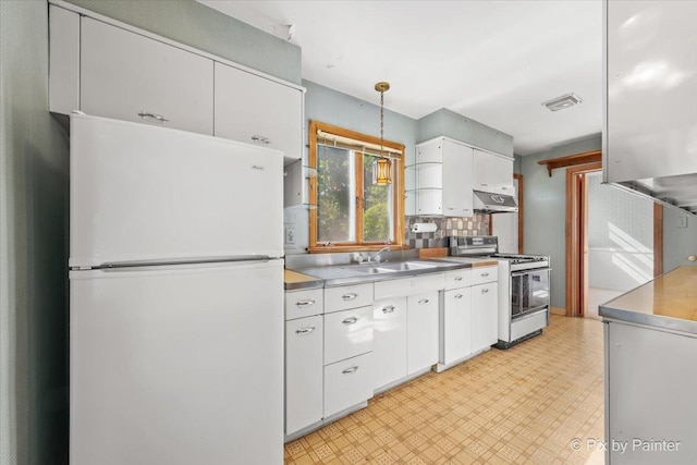 1029 S 5th St, Saint Charles, IL 60174 - kitchen with white appliances, a sink, light floors, white cabinets, and under cabinet range hood