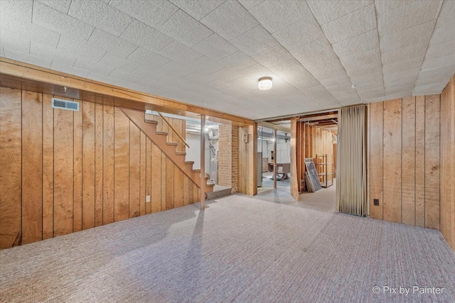 1029 S 5th St, Saint Charles, IL 60174 - finished basement featuring wooden walls, carpet, and stairway