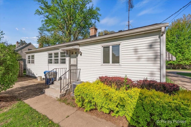 1029 S 5th St, Saint Charles, IL 60174 - single story home featuring a chimney and central air condition unit