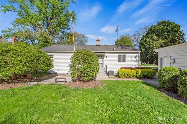1029 S 5th St, Saint Charles, IL 60174 - rear view of property with a lawn, a chimney, and cooling unit