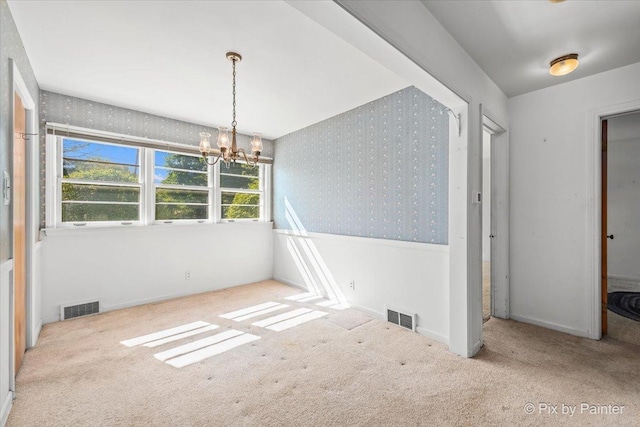 1029 S 5th St, Saint Charles, IL 60174 - unfurnished dining area with wallpapered walls, carpet floors, a chandelier, and baseboards