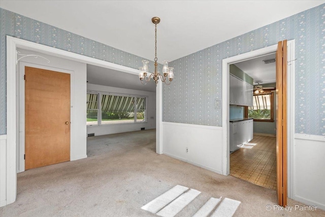 1029 S 5th St, Saint Charles, IL 60174 - unfurnished dining area with wallpapered walls, a chandelier, and carpet