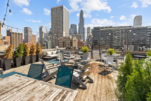 225 W Huron St Unit 402, Chicago, IL 60654 - wooden deck featuring a skyline view