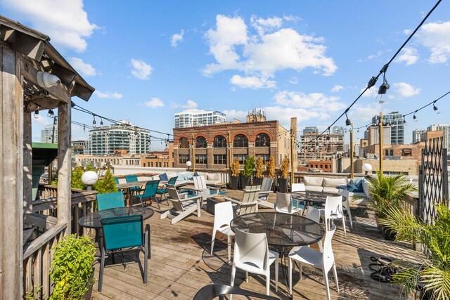 225 W Huron St Unit 402, Chicago, IL 60654 - wooden deck featuring outdoor dining space and a view of city