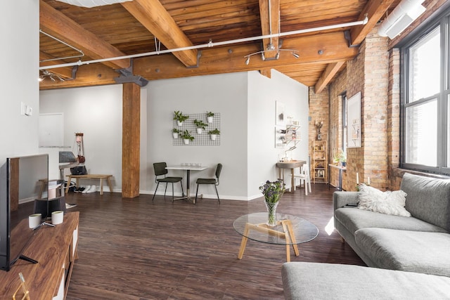 225 W Huron St Unit 402, Chicago, IL 60654 - living room featuring wood ceiling, beam ceiling, brick wall, wood finished floors, and baseboards
