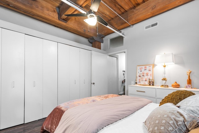 225 W Huron St Unit 402, Chicago, IL 60654 - bedroom featuring a closet, wood ceiling, dark wood-style flooring, and beam ceiling