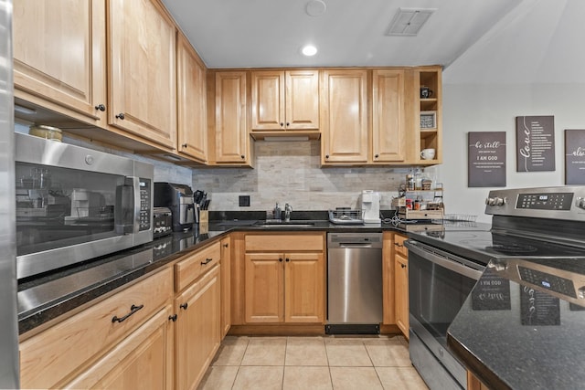 310 Lathrop Ave Unit 202-204, Forest Park, IL 60130 - kitchen with stainless steel appliances, a sink, light tile patterned floors, tasteful backsplash, and dark stone countertops
