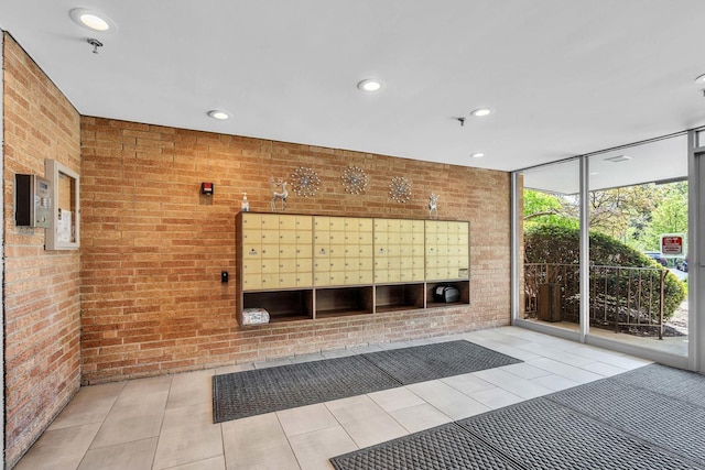 view of property's community featuring brick wall, floor to ceiling windows, recessed lighting, and mail area