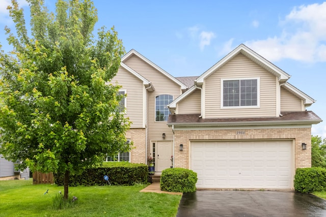 1984 Seaview Dr, Aurora, IL 60503 - traditional-style home featuring brick siding, driveway, a garage, and a front yard