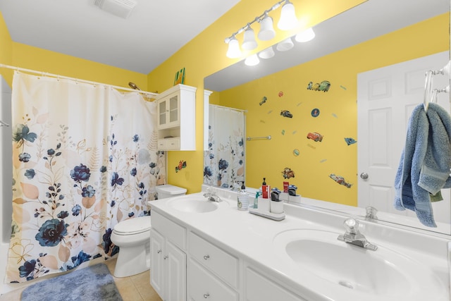 1984 Seaview Dr, Aurora, IL 60503 - full bath featuring tile patterned floors, toilet, double vanity, and a shower with curtain