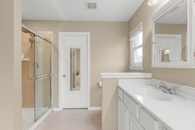 1984 Seaview Dr, Aurora, IL 60503 - bathroom with a stall shower, vanity, tile patterned floors, and baseboards