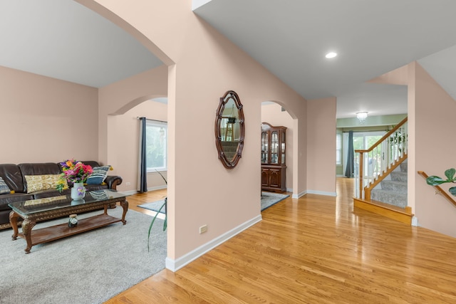 1984 Seaview Dr, Aurora, IL 60503 - corridor with light wood-style floors, arched walkways, stairs, baseboards, and recessed lighting