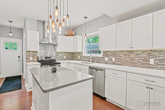 28271 W Stewart Ave, Spring Grove, IL 60081 - kitchen featuring appliances with stainless steel finishes, plenty of natural light, wood finished floors, and backsplash