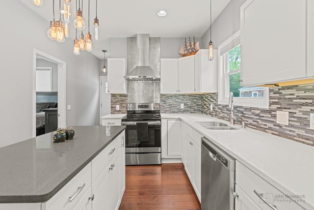 28271 W Stewart Ave, Spring Grove, IL 60081 - kitchen with stainless steel appliances, wall chimney exhaust hood, a sink, backsplash, and recessed lighting