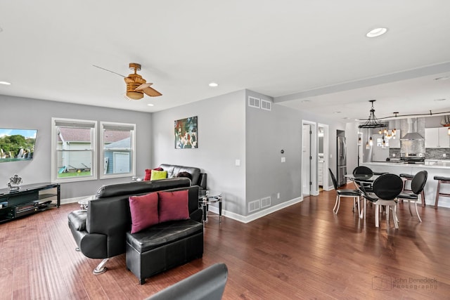 28271 W Stewart Ave, Spring Grove, IL 60081 - living room featuring ceiling fan, wood finished floors, recessed lighting, baseboards, and a chandelier