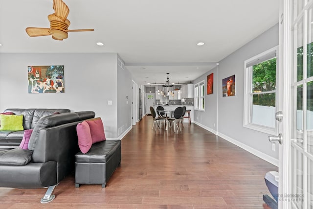 28271 W Stewart Ave, Spring Grove, IL 60081 - living room with a chandelier, wood finished floors, baseboards, recessed lighting, and ceiling fan