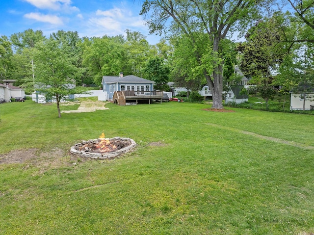 28271 W Stewart Ave, Spring Grove, IL 60081 - view of grassy yard with an outdoor fire pit and a deck
