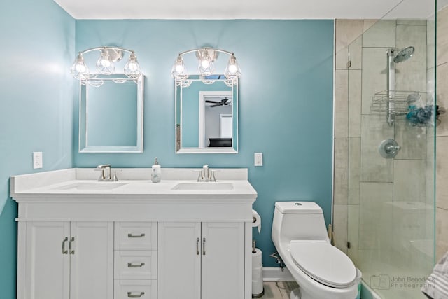 28271 W Stewart Ave, Spring Grove, IL 60081 - bathroom featuring toilet, double vanity, a shower stall, and a ceiling fan