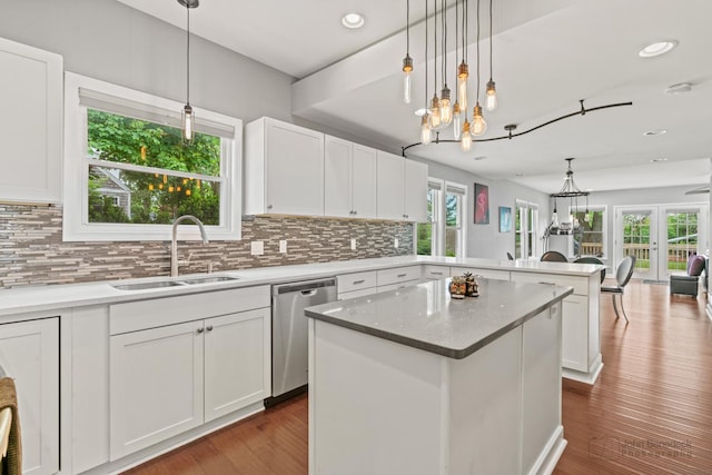 28271 W Stewart Ave, Spring Grove, IL 60081 - kitchen featuring dishwasher, a sink, a chandelier, a peninsula, and tasteful backsplash