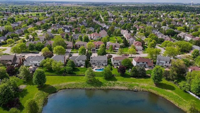 aerial view of residential area featuring a nearby body of water