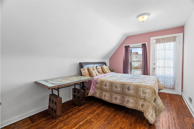 6914 S Cregier Ave, Chicago, IL 60649 - bedroom with dark wood-type flooring, baseboards, and vaulted ceiling