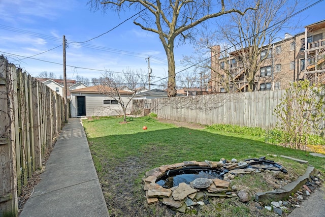 6914 S Cregier Ave, Chicago, IL 60649 - view of yard featuring an outbuilding and a fire pit