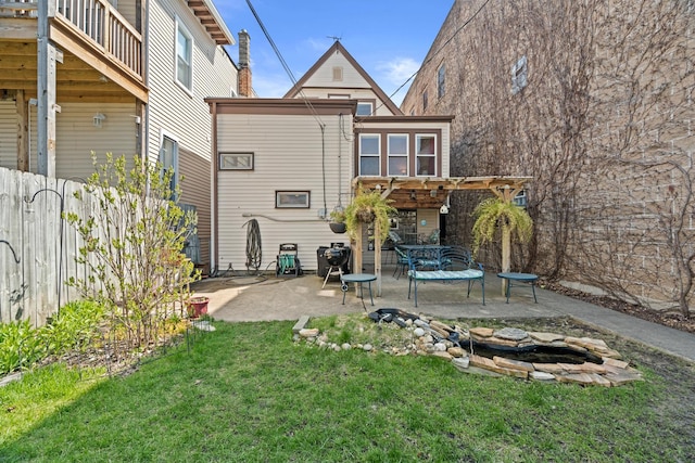 6914 S Cregier Ave, Chicago, IL 60649 - rear view of property featuring a pergola, a patio area, a yard, and a fire pit