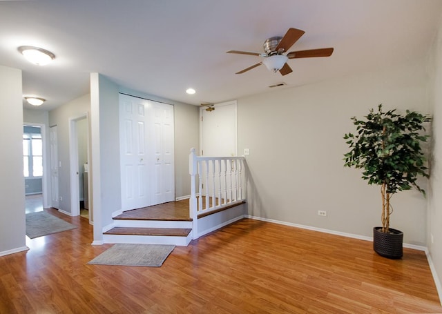 bedroom featuring wood finished floors, baseboards, a closet, recessed lighting, and ceiling fan