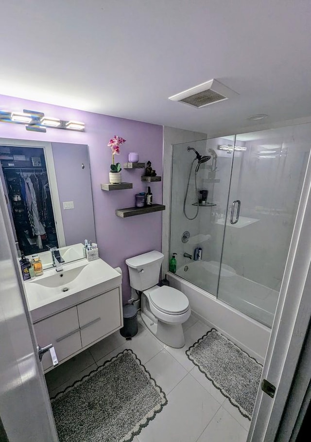 465 W Dominion Dr Unit 1304, Wood Dale, IL 60191 - full bathroom featuring vanity, toilet, bath / shower combo with glass door, and a spacious closet