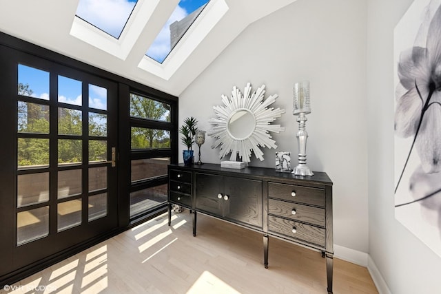 509 Burr Oak Pl, Hinsdale, IL 60521 - entryway with lofted ceiling, wood finished floors, a skylight, and baseboards