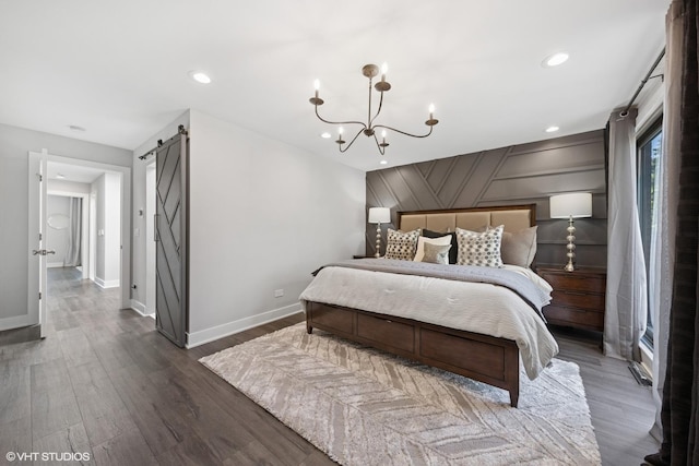 509 Burr Oak Pl, Hinsdale, IL 60521 - bedroom with a barn door, baseboards, wood finished floors, a chandelier, and recessed lighting