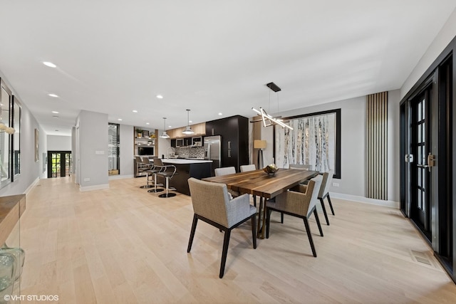 509 Burr Oak Pl, Hinsdale, IL 60521 - dining room with light wood-style floors and baseboards