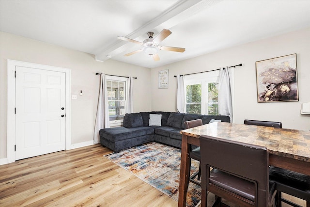224 S 8th St, Dekalb, IL 60115 - living area with light wood-type flooring, plenty of natural light, a ceiling fan, beamed ceiling, and baseboards