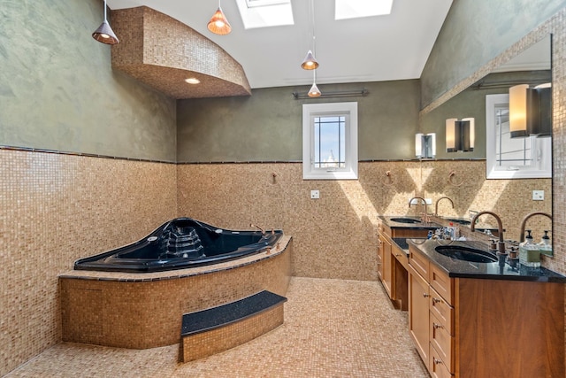8260 W Argyle St, Norridge, IL 60706 - full bathroom with tile walls, a garden tub, double vanity, and wainscoting