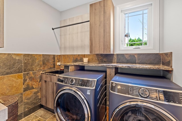 8260 W Argyle St, Norridge, IL 60706 - laundry area with washing machine and clothes dryer, cabinet space, tile walls, and a wainscoted wall