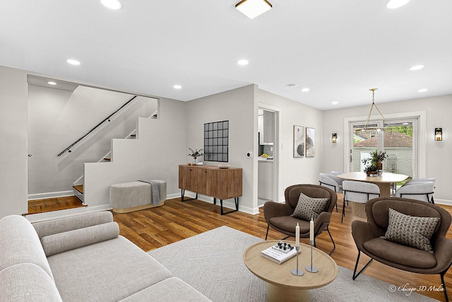 5935 Carol Ave, Morton Grove, IL 60053 - living area featuring stairway, wood finished floors, baseboards, and recessed lighting