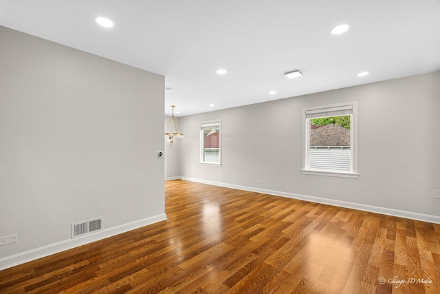5935 Carol Ave, Morton Grove, IL 60053 - spare room featuring wood finished floors, baseboards, and recessed lighting