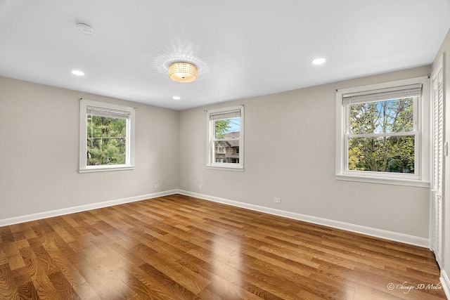 5935 Carol Ave, Morton Grove, IL 60053 - spare room featuring baseboards, wood finished floors, recessed lighting, and a smoke detector