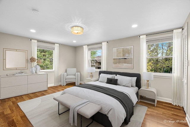 5935 Carol Ave, Morton Grove, IL 60053 - bedroom with multiple windows, baseboards, recessed lighting, and light wood-style floors