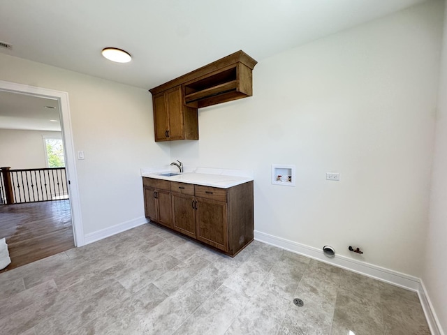 laundry area featuring hookup for a gas dryer, baseboards, and hookup for a washing machine